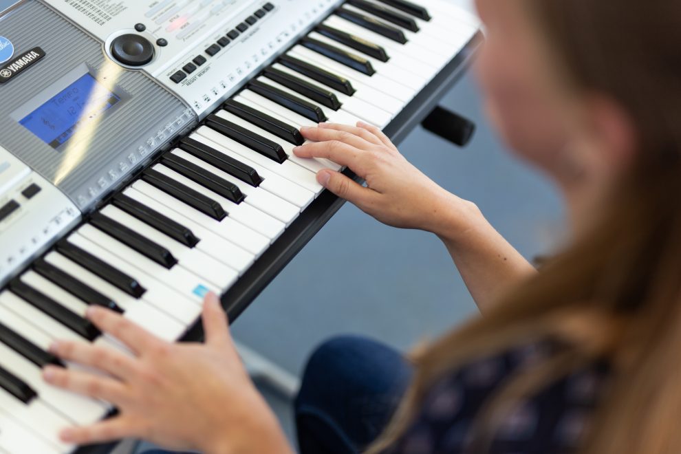 A woman playing the keyboard